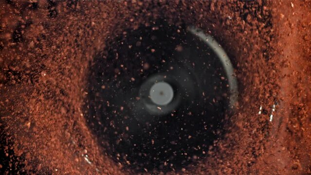 A working grinder with ground coffee. Top view. Filmed on a high-speed camera at 1000 fps. High quality FullHD footage