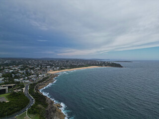 Fototapeta na wymiar Aerial view of a cloudy sky over Curl Curl Beach, Curl Curl, NSW, Australia
