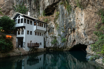 Blagaj tekke and Buna river source at foot of stone cliff. Dervish tekke near Mostar