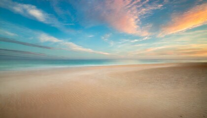 Fototapeta na wymiar morning breaks on a serene beach with the horizon painted in pastels offering an expansive sand canvas for designers