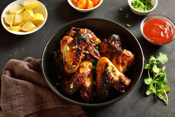 Grilled chicken wings in bowl