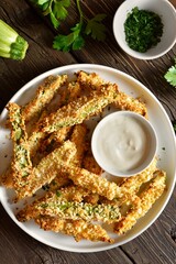 Crunchy zucchini breaded sticks served with dip sauce