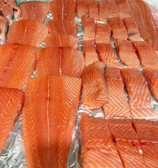 Raw Fresh Seafood on Ice Stand at Market Close Up. Salmon Steaks