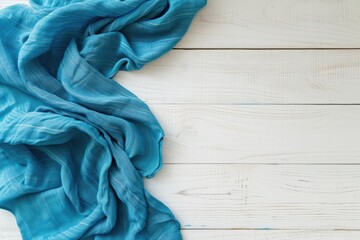 Mock up design with blue tablecloth and white wood tabletop