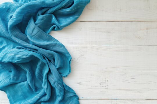 Mock up design with blue tablecloth and white wood tabletop