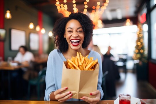 Smiling Person Presenting A Paper Bag Full Of Fries With A Gift Tag