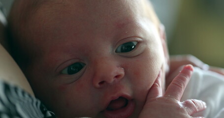 Newborn baby close-up first days of life awake observing learning about the world