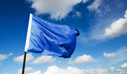 Blue flag waving on sky