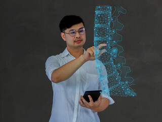 Doctor shows a patient's spinal anatomy, checks the test result on the virtual interface and analyzes the data. Skeleton disease, medicine of the future.