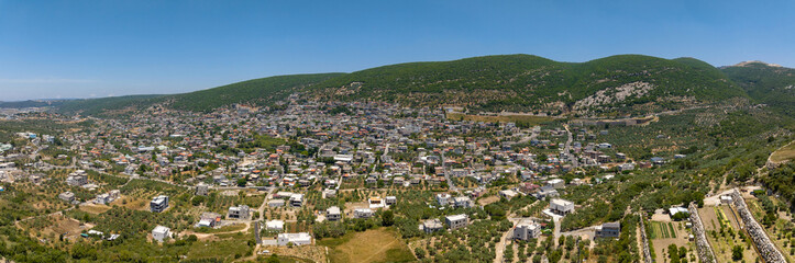Fototapeta na wymiar Aerial view of Pekiin Druze village houses in northern Israel