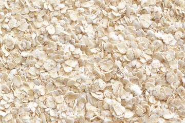 Rolled oats texture background. Healthy breakfast oatmeal. Dietary and weight loss concept. Food for skincare.