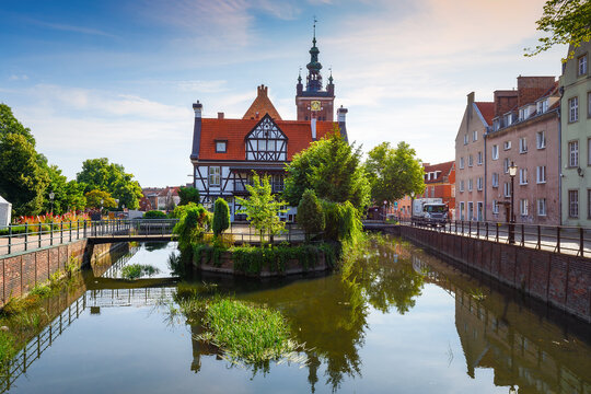 Gdansk, Poland - July 15, 2023: View of the Millers' Guild house and the Radunia Canal in Gdansk on a sunny summer day. Popular tourist attraction