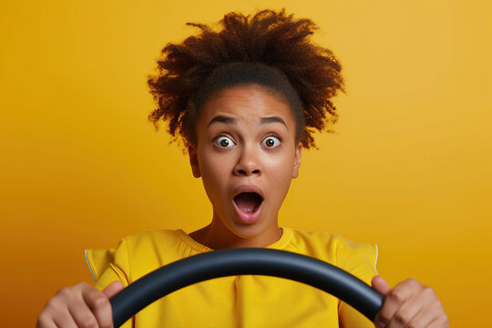 Photo of shocked African American lady buy new car impressed fast speed control steering wheel isolated on vibrant color background