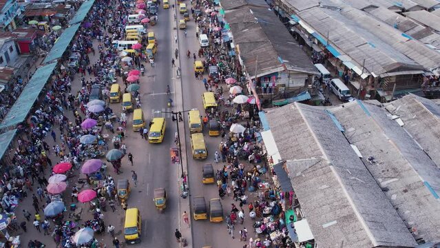 4th March 2023,Abuja Nigeria:Drone  Aerial crowd shot of African people, a huge queue of cars,trucks  drive at cross road. Traffic highway transportation in Nigeria Africa