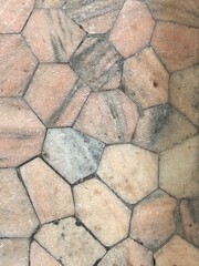 Tiles with varied shapes orange, black and beige. 