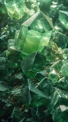 A vivid cluster of green crystals, each facet catching the light, nestled in sand
