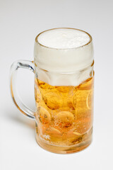 a pint full of beer on a table in the kitchen