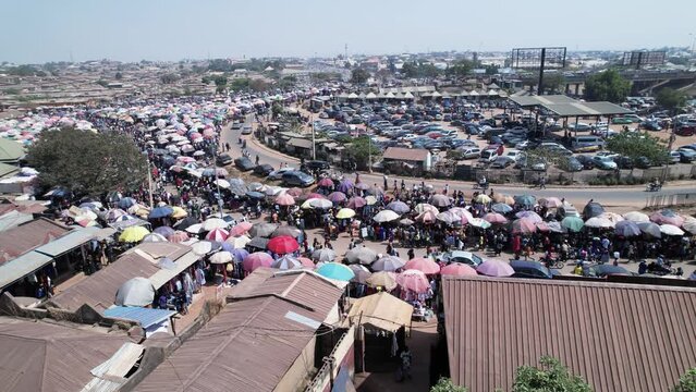 4th March 2023,Abuja Nigeria:Drone  Aerial crowd shot of African people, a huge queue of cars,trucks  drive at cross road. Traffic highway transportation in Nigeria Africa