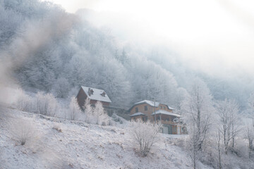 cottege house in winter landscape in mountains. High quality photo
