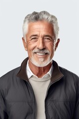 A man with a white beard wearing a black jacket. Suitable for various concepts and themes