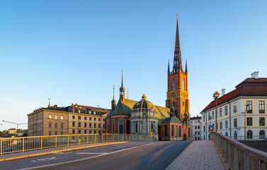 The Riddarholmen Church in Stockholm, Sweden. Cityscape of Stockholm, Sweden. Evening time and soft sunlight. A walk through the city. Panoramic view.