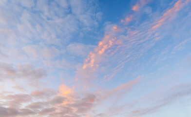 Beautiful sunset sky. Sunset sky with Cirrus clouds. The gentle sky on the horizon. Natural sky,...