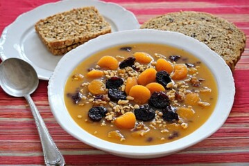 Anoush Abour (Sweet Soup) A dessert soup made with dried fruits like apricots, raisins, and prunes, cooked by ai generated