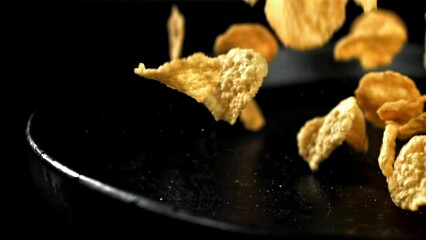 Corn flakes falling on plate. Filmed on a high-speed camera at 1000 fps. High quality FullHD footage - Powered by Adobe