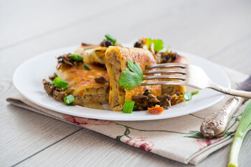 fried thin pancakes stuffed with meat and mushrooms.