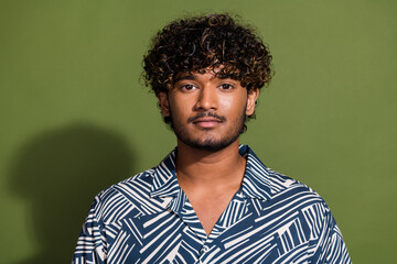 Portrait photo of young mexican stubble guy in stylish shirt man with curly hair serious expression...