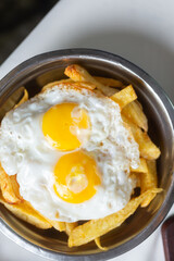 two fried eggs with fries