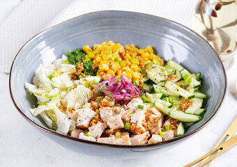 Chinese cabbage salad with chicken meat, corn, cucumber and dressing mustard. Asian food.
