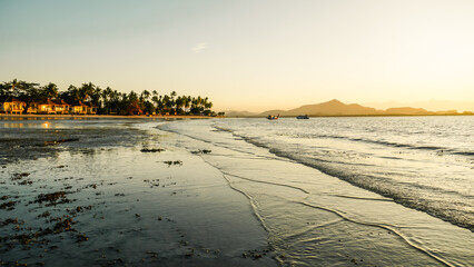 The sea with twilight sky in morning at koh mook, Trang province, Thailand. Tropical sunset or sunrise Landscape light by the sea.