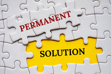 Permanent Solution text on missing jigsaw puzzle. Strategic problem solving concept.