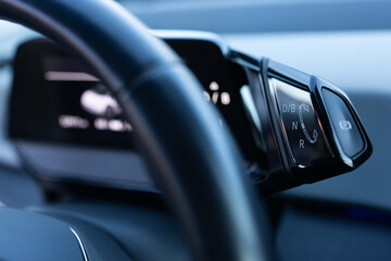 Handle of electric car gearbox control. Design details of minimalist concept of electric car -...