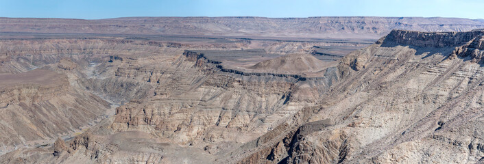 escarpment worn slopes and meandering dry riverbed looking north from Canyon viewpoint, Fish River Canyon,  Namibia
