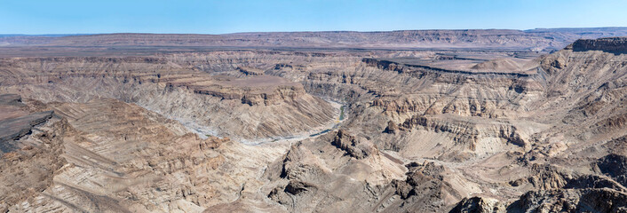 escarpment worn slopes and meandering riverbed looking west from Canyon viewpoint, Fish River Canyon,  Namibia