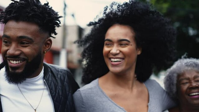 Happy Brazilian Group of African Descent United in Laughter and Embrace, Urban Street Pose. Family united together portrait of latin faces of South America