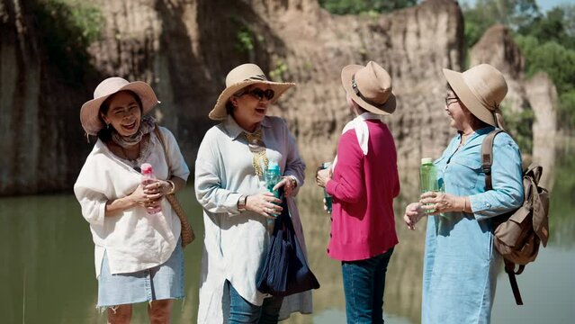 Portrait, best friends, group elderly Asian women have been close for long time, make appointment go hiking on nice day, even though, get dressed ready walk, carry bottle water for each person