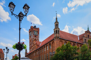 Gothic building of a medieval City Hall in Torun, Poland. Magnificent clock tower. The mediaeval...