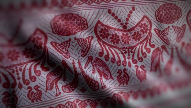 Assamese Gamosa or Gamusa embroidery motifs fabric wave loop. Muga silk cloth fluttering in the wind or waving red and white cloth with a red Indian pattern