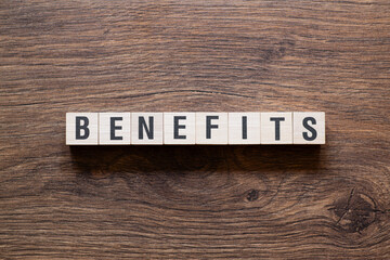 Benefits - word concept on building blocks, text