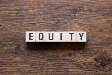 Equity - word concept on building blocks, text