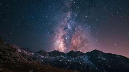 Night sky stars. Milky way across mountains landscape, stock photo