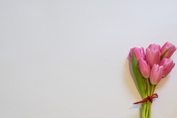 Pink Tulips for Spring Time Bouquet on the right hand side of the image