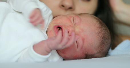 Newborn baby infant sleeping in bed