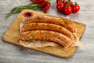 Raw sausages with spices and herbs