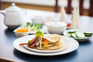 Washable wall murals Beijing peking duck on a plate with pancakes and sauce