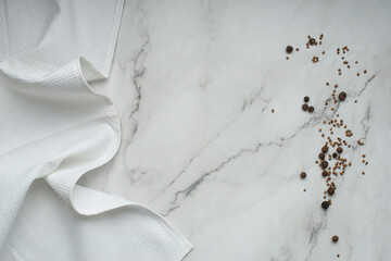 White marble table with towel and spices, cooking food