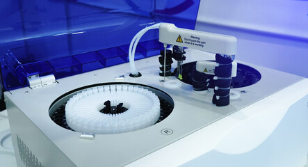 Centrifuge rotor machine with test tubes standing in laboratory for medical and scientific...